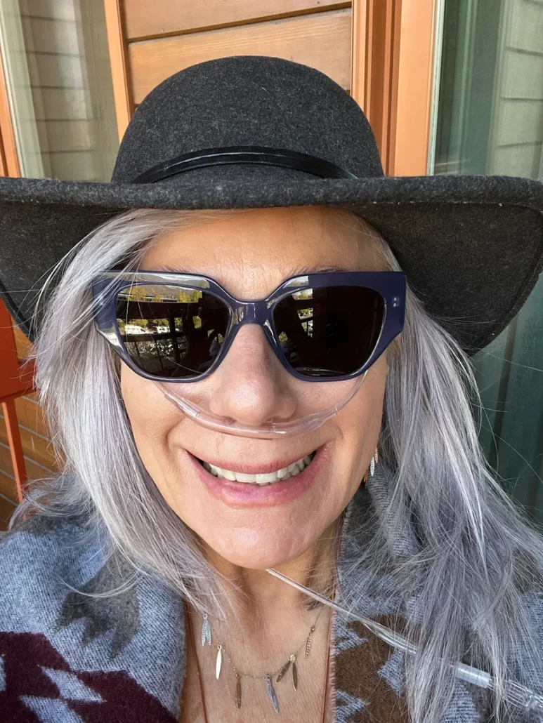 Lady using oxygen unit for clarity & rid altitude headaches